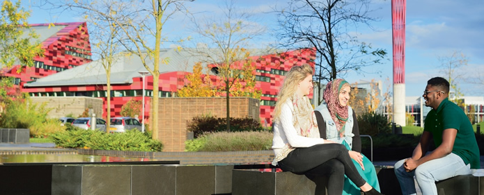 Erasmus+ students sit outside on Nottingham University campus 