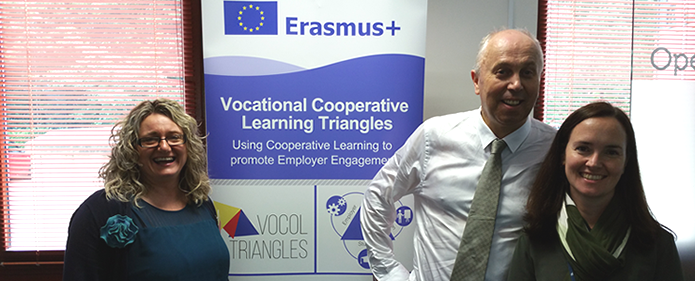 Participants involved in the Erasmus+ VOCOL project stand next to a project banner